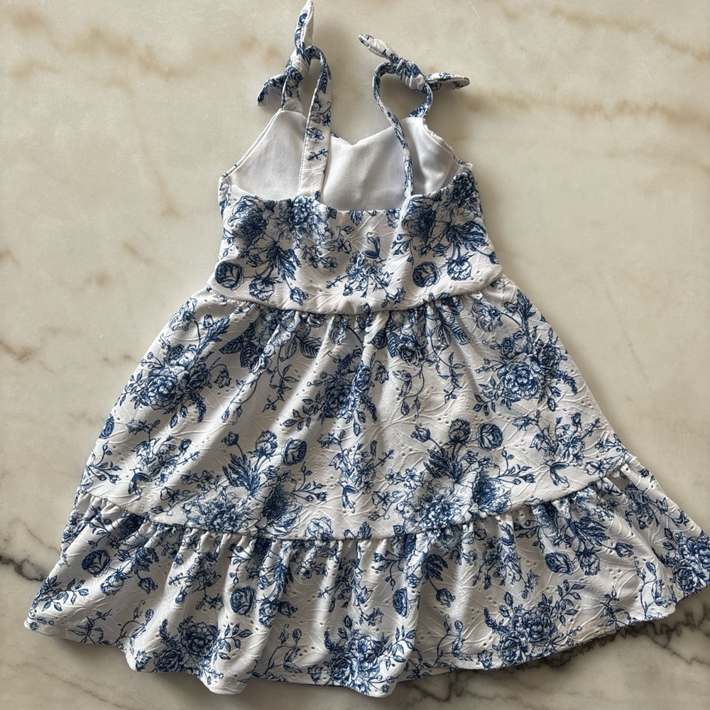Blue and white floral babydoll dress with ruffles and tie straps. Size: 4 years - Picture 2 of 3